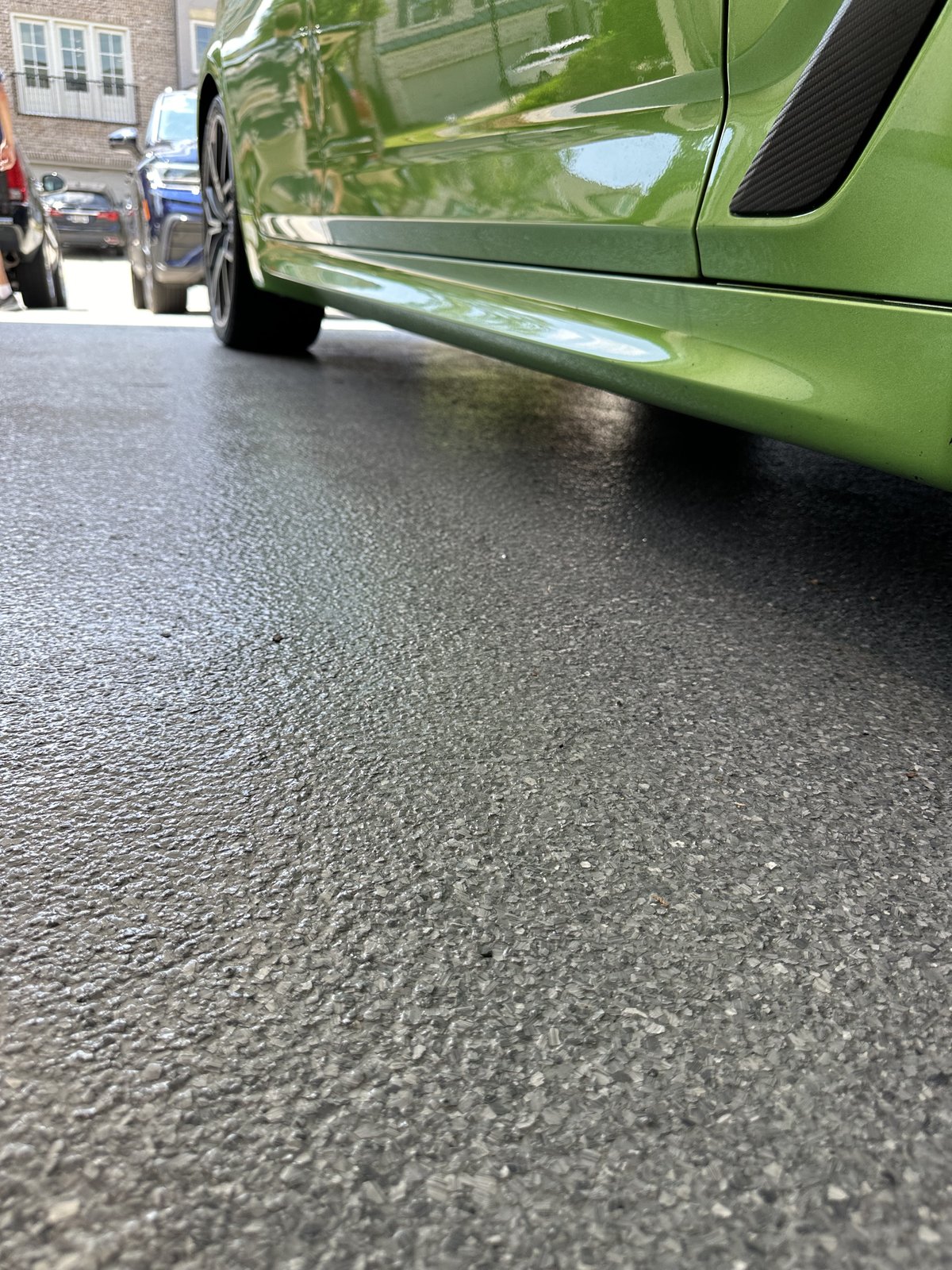Coated garage floor close-up with car reflection