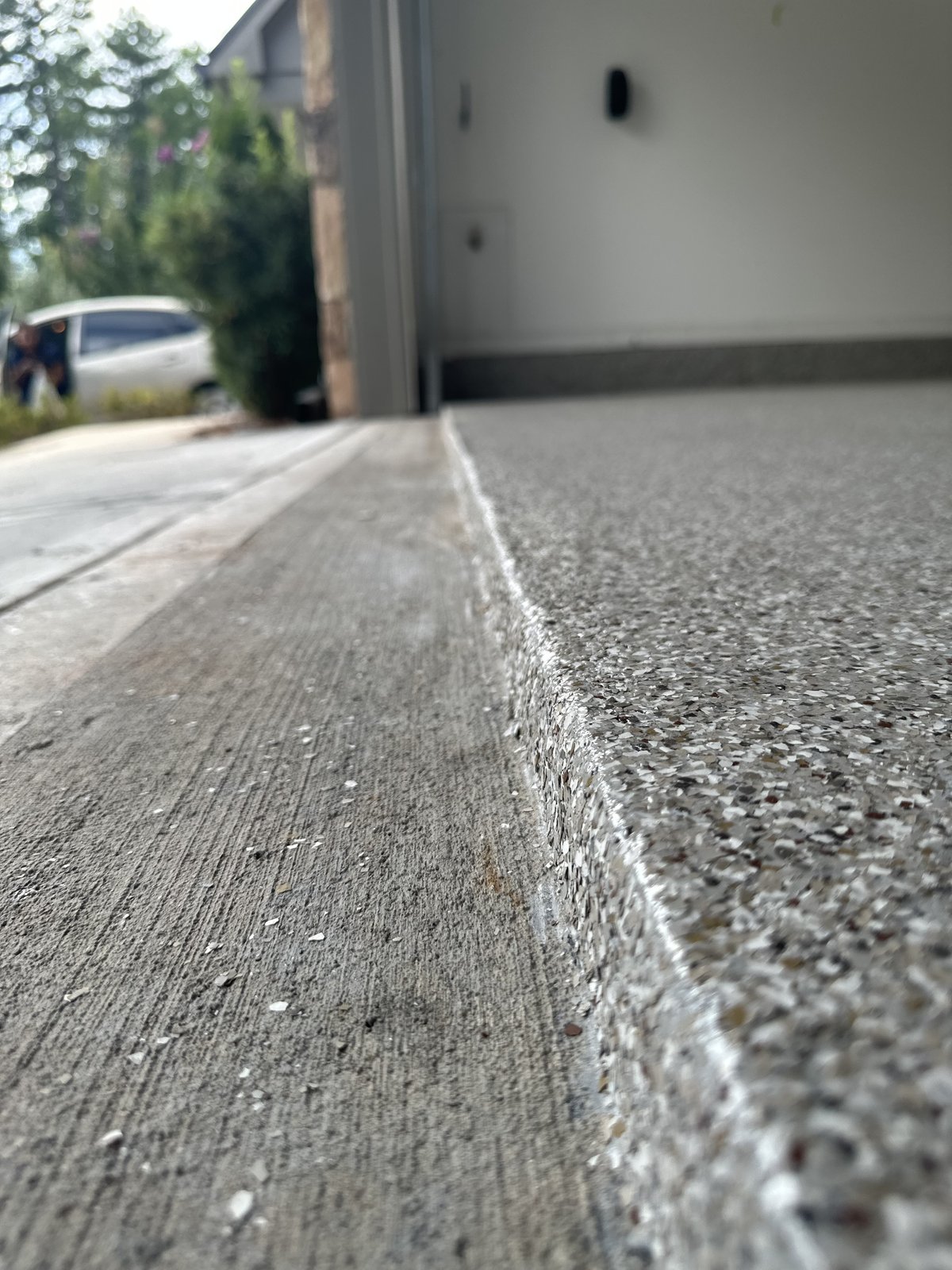 Coating edge detail at garage threshold